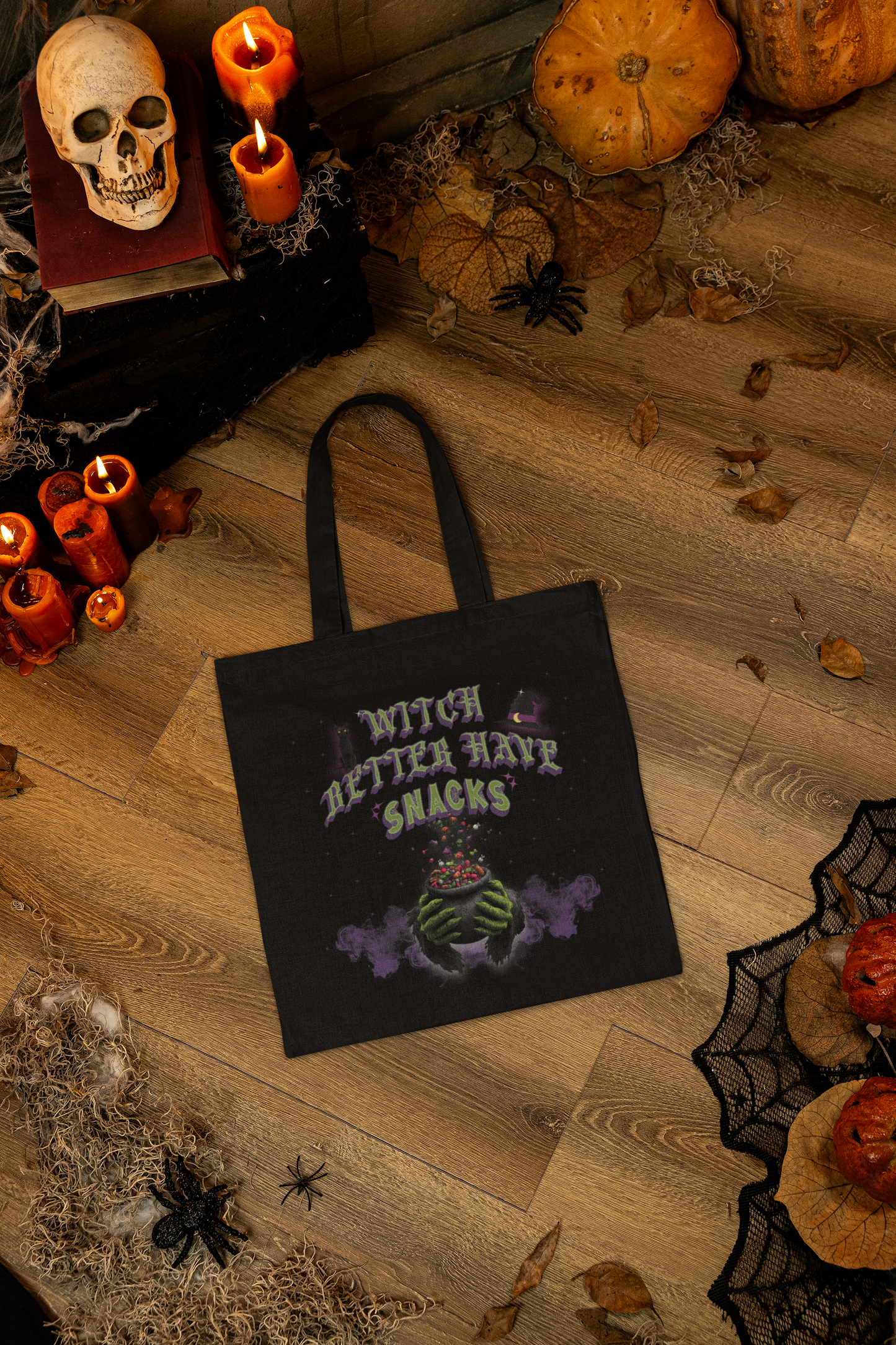 Halloween tote featuring purple smoke and witch cauldron with snacks