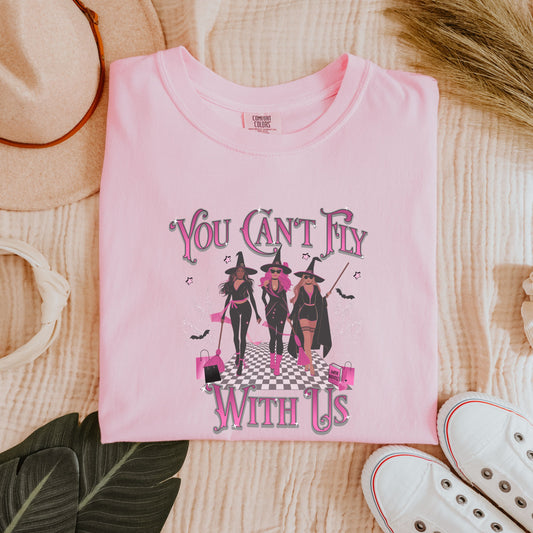 Flat lay of “You Can’t Fly With Us” Comfort Colors® tee styled with jeans and boots for Halloween outfit inspo