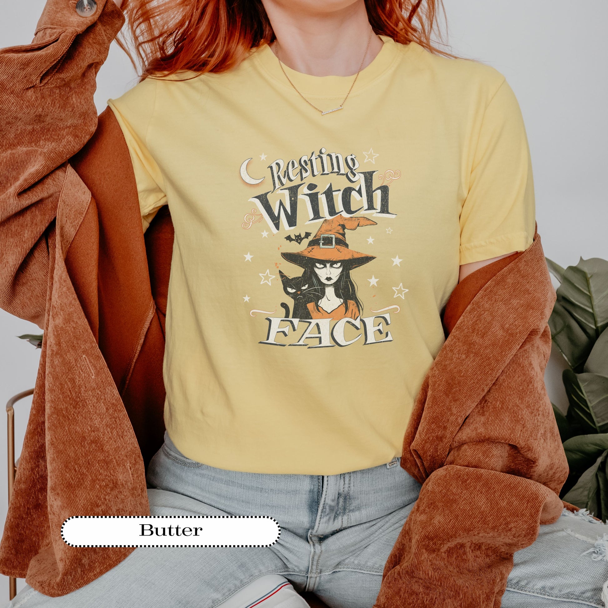 Black cat and witch design shirt – gothic Halloween graphic top for women.