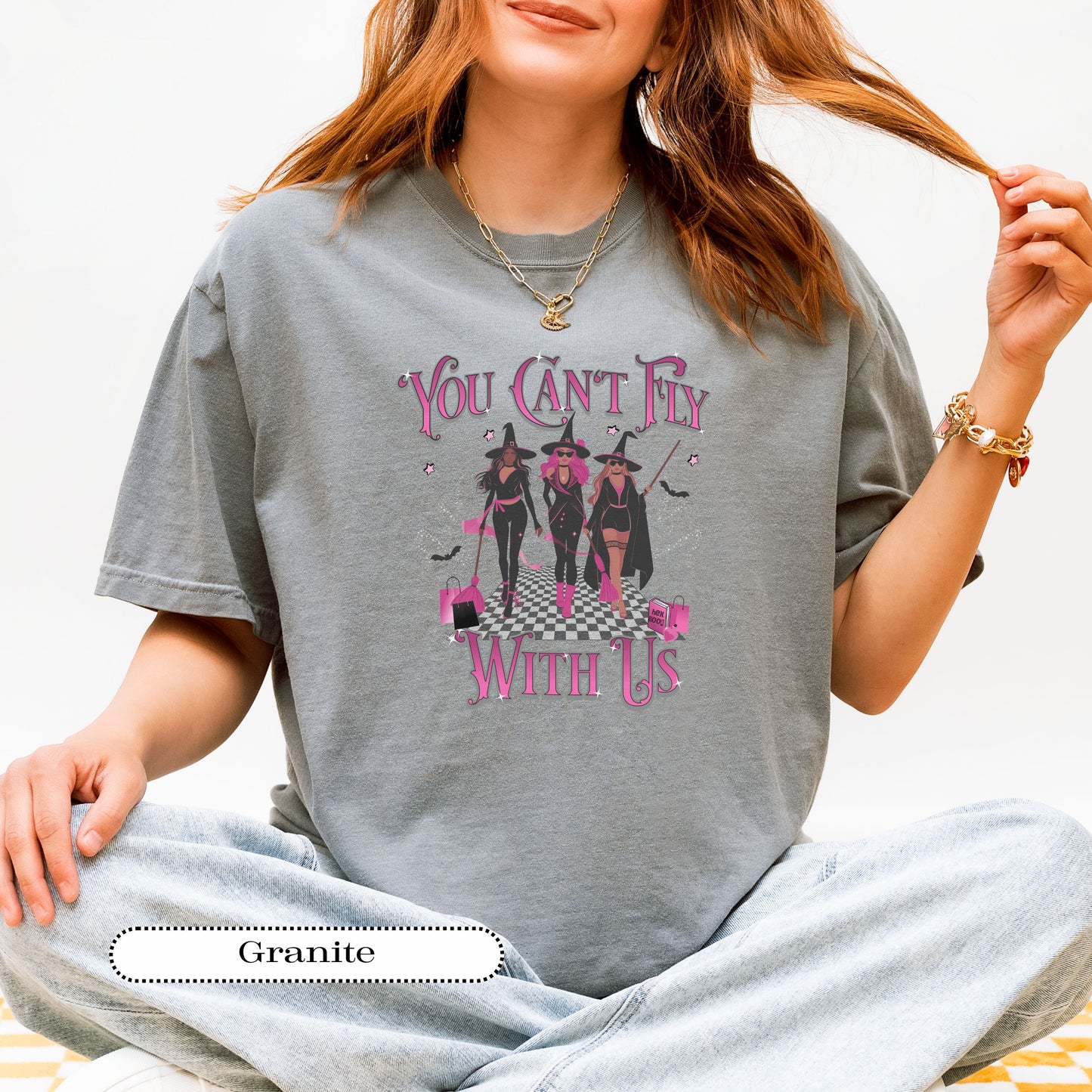 Halloween girl gang shirt with retro “You Can’t Fly With Us” design, pink accents, and witch hats