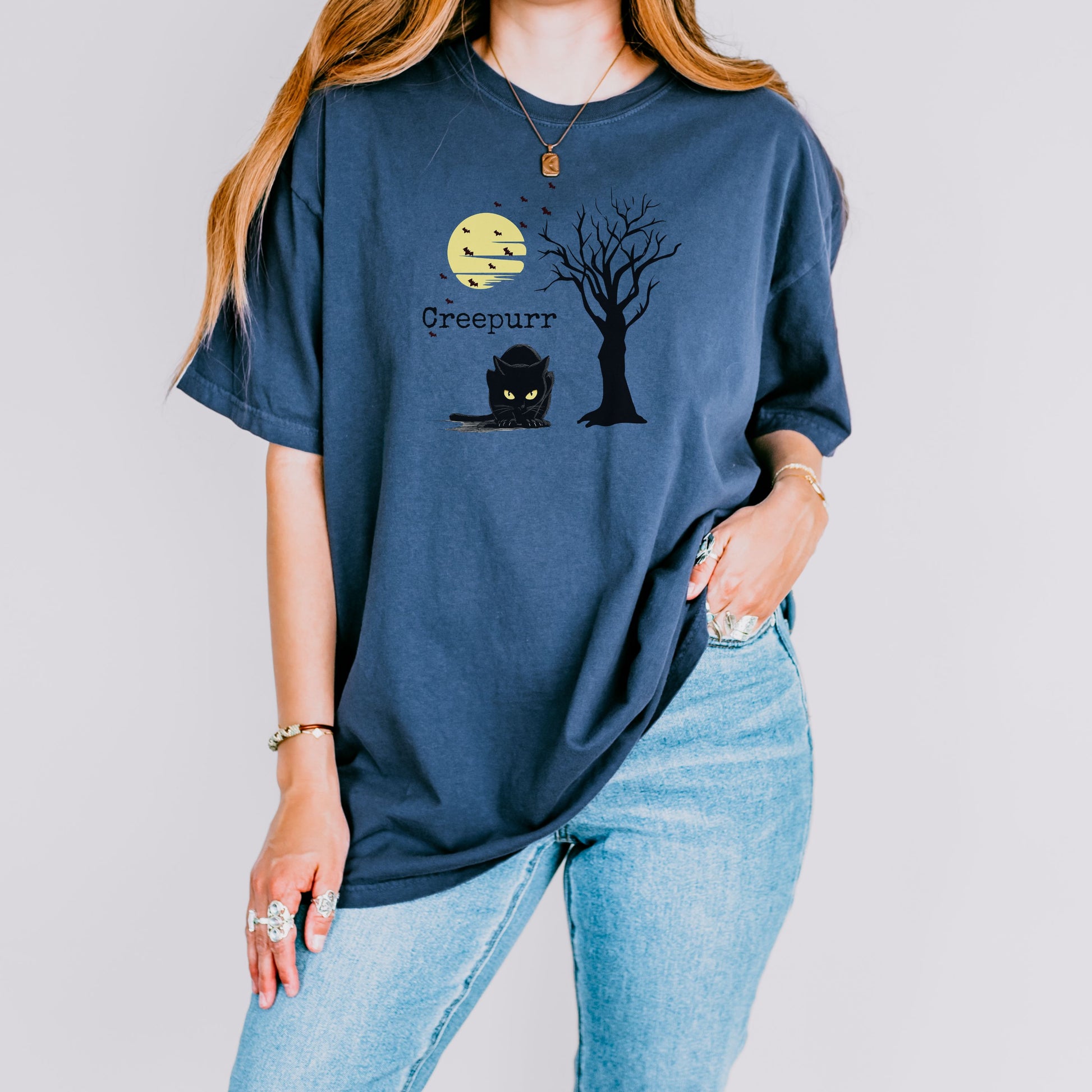 Halloween party outfit idea, spooky black cat t-shirt with moon and bats, gothic graphic style.