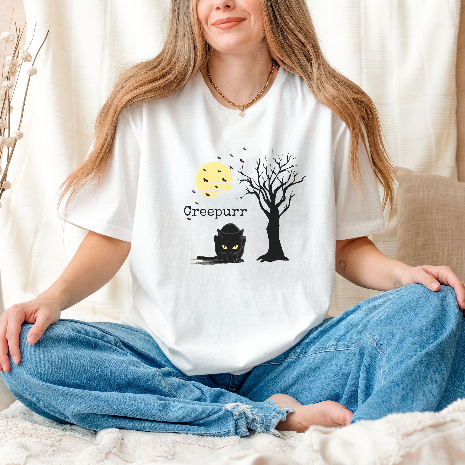 Unisex Comfort Colors tee, vintage Halloween shirt with creepy cat and retro spooky season design.
