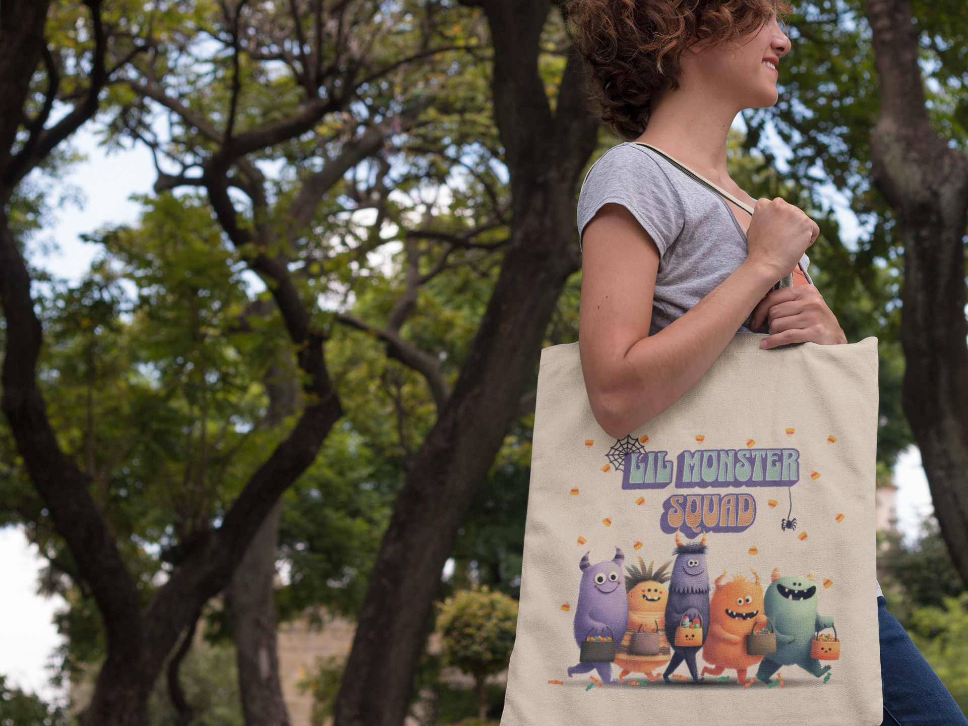Kids trick or treat bag featuring smiling monsters and festive artwork
