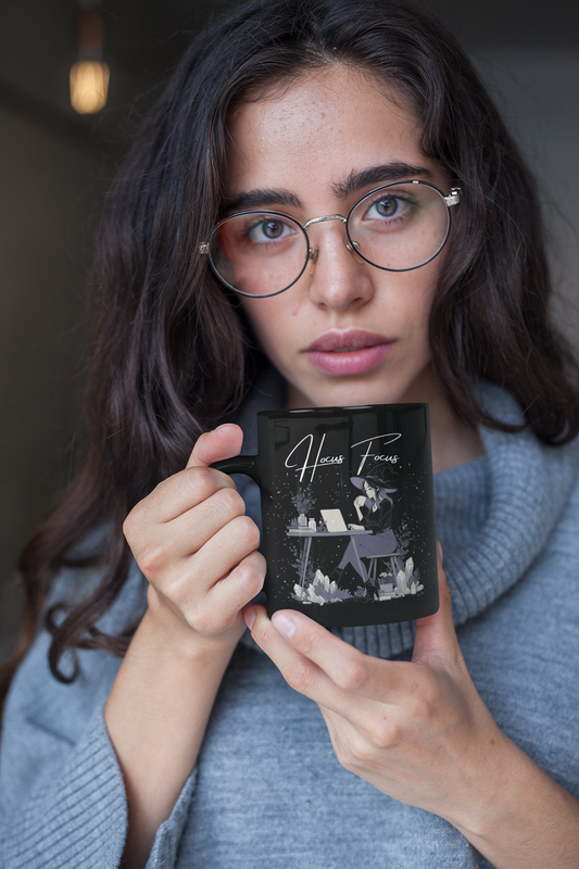 Matte black witch coffee mug with “Hocus Focus” text and cute witch laptop design