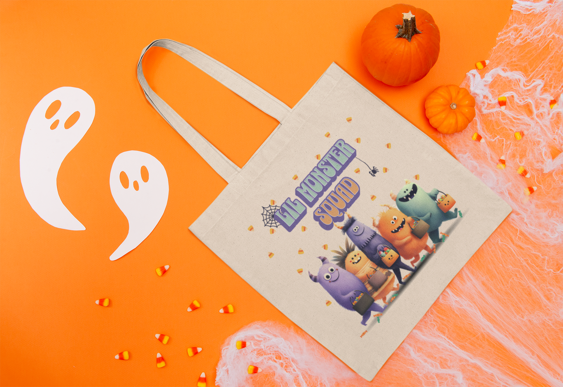 Halloween tote bag with colorful monster squad design and candy corn accents