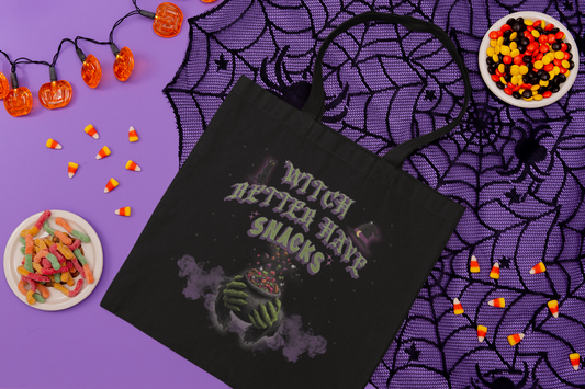Black tote bag with “Witch Better Have Snacks” text and cauldron graphic